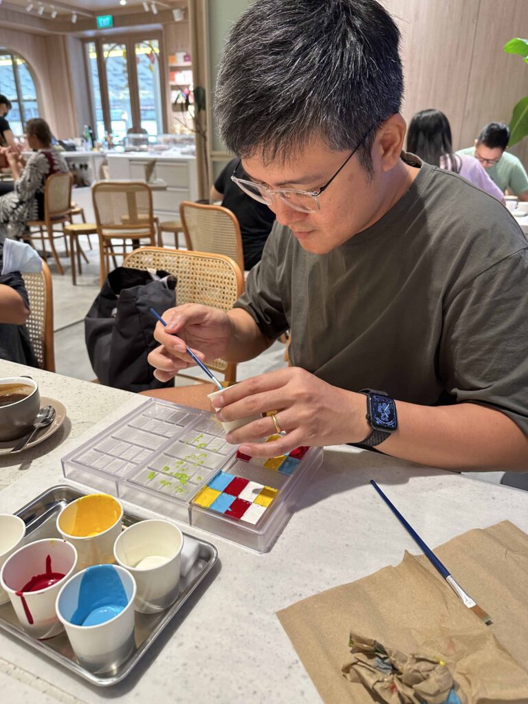 Edwin making a personalised chocolate bar at Mr Bucket Dempsey