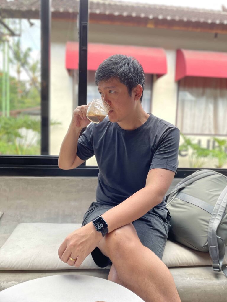 Edwin sipping a cup of mocha coffee in Ubud Bali