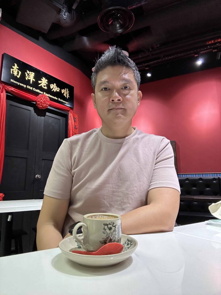 Edwin enjoying a local cuppa of nanyang coffee - kopi siew dai